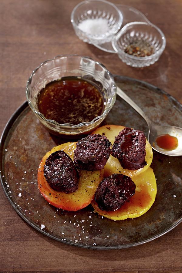 Black Pudding With Apples And Sauce Photograph by Alessandra Pizzi