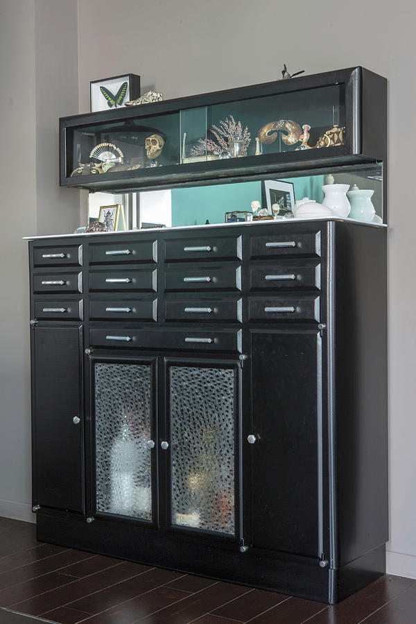 Black Retro Cabinet With Curiosities In Glass-fronted Modules Photograph by Anne-catherine Scoffoni