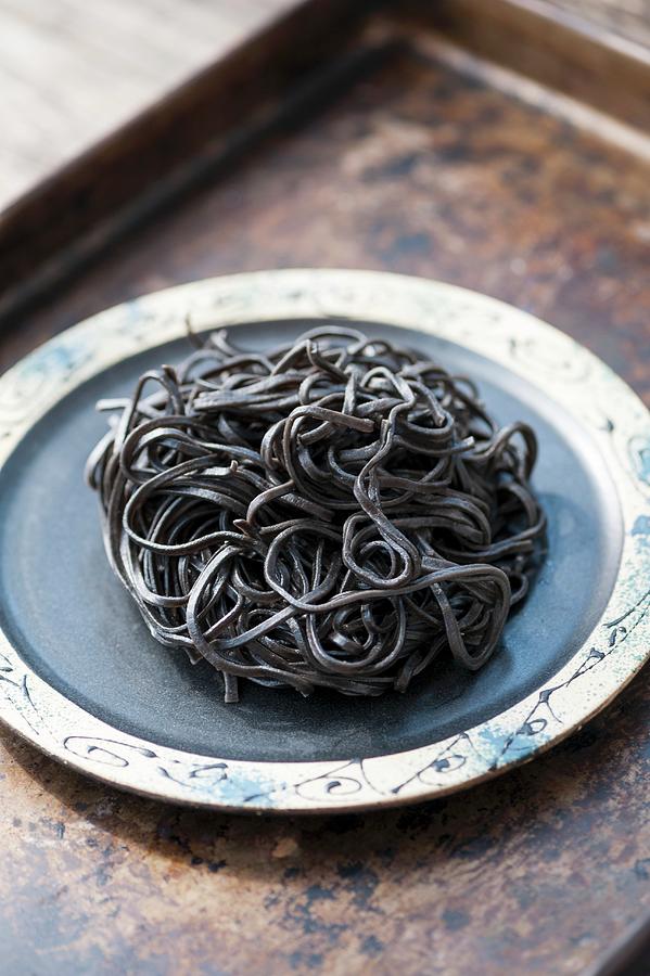 Black Squid Ink Pasta On A Plate Photograph by Gabriela Lupu - Fine Art ...