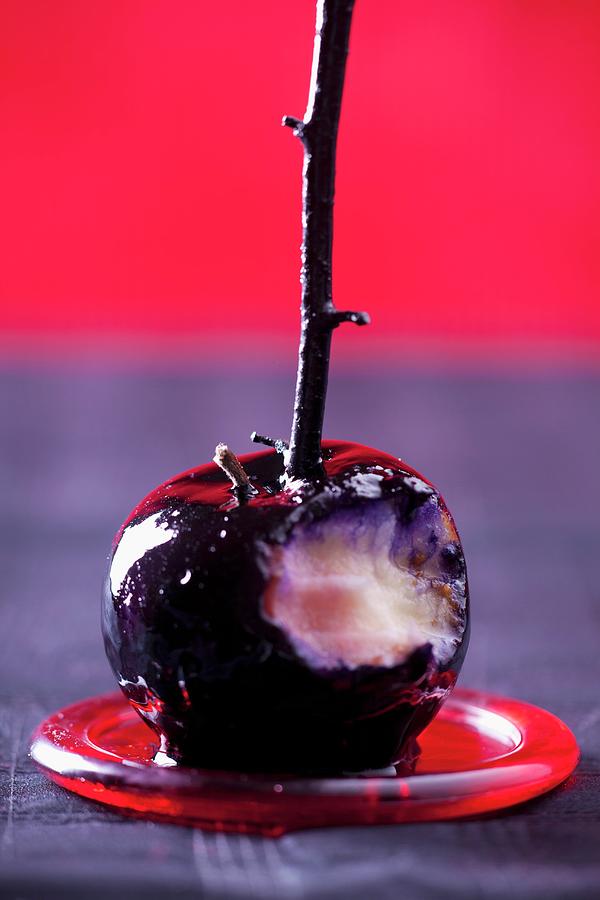 Black Toffee Apple, Bitten Into Photograph by Studio Lipov