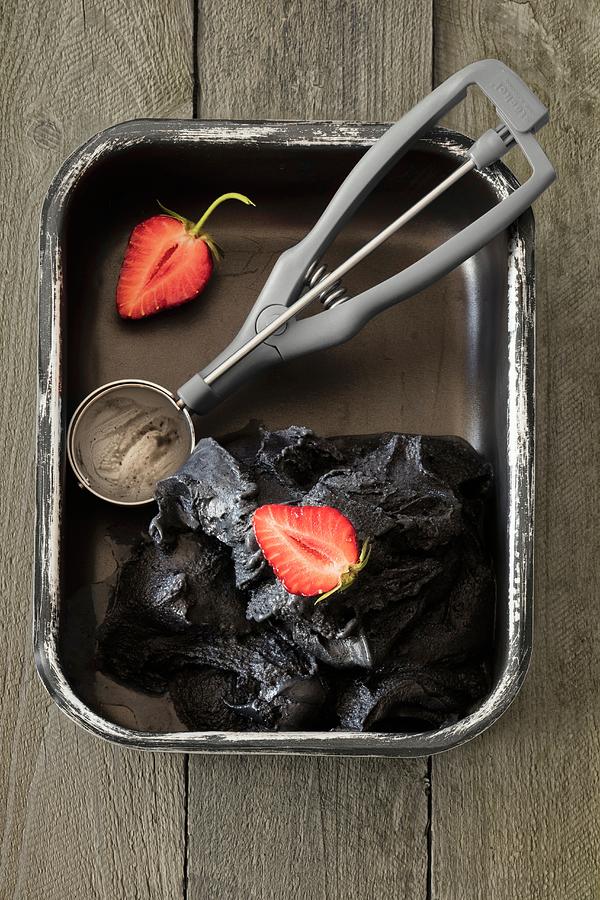Black Vanilla Ice Cream With An Ice Cream Scoop Photograph by Jan Wischnewski