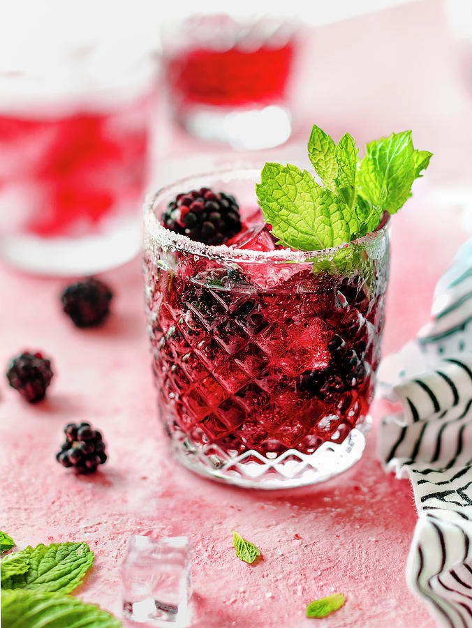 Blackberry Bourbon Smash With Mint Leaves And Ice Cubes Photograph by Maria Squires