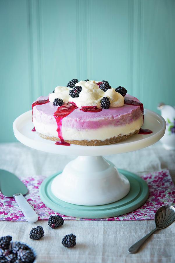 Blackberry Cheesecake On A Cake Stand With Cream And Fresh Blackberries Photograph by Magdalena Hendey