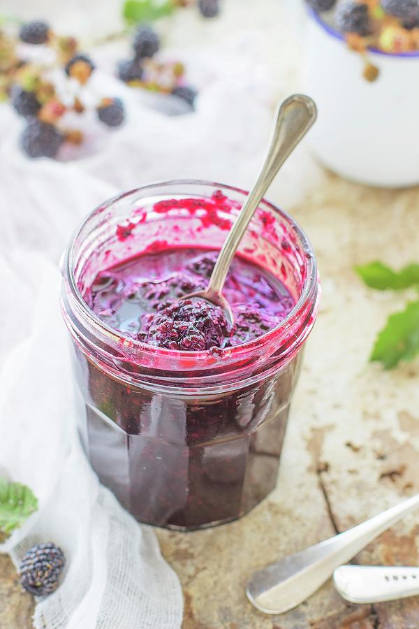 Blackberry Jam In A Jar With A Spoon Photograph by Ileana Pavone
