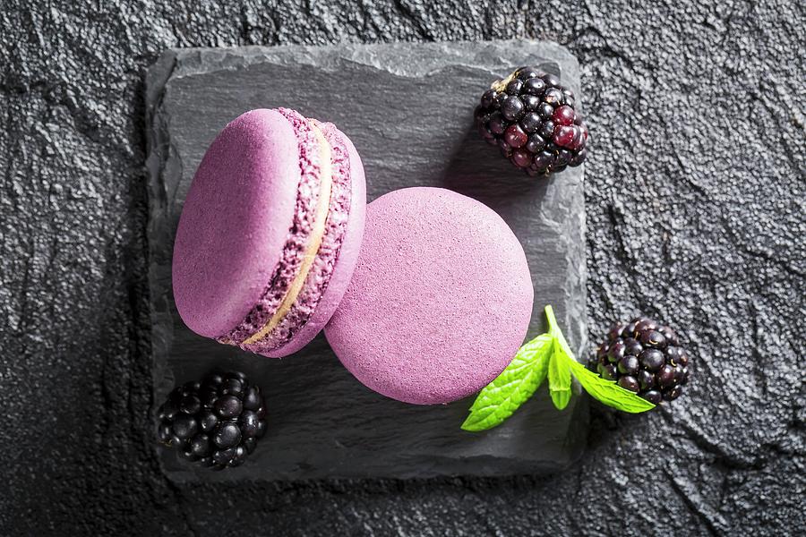 Blackberry Macaroons On A Black Stone Photograph by Shaiith