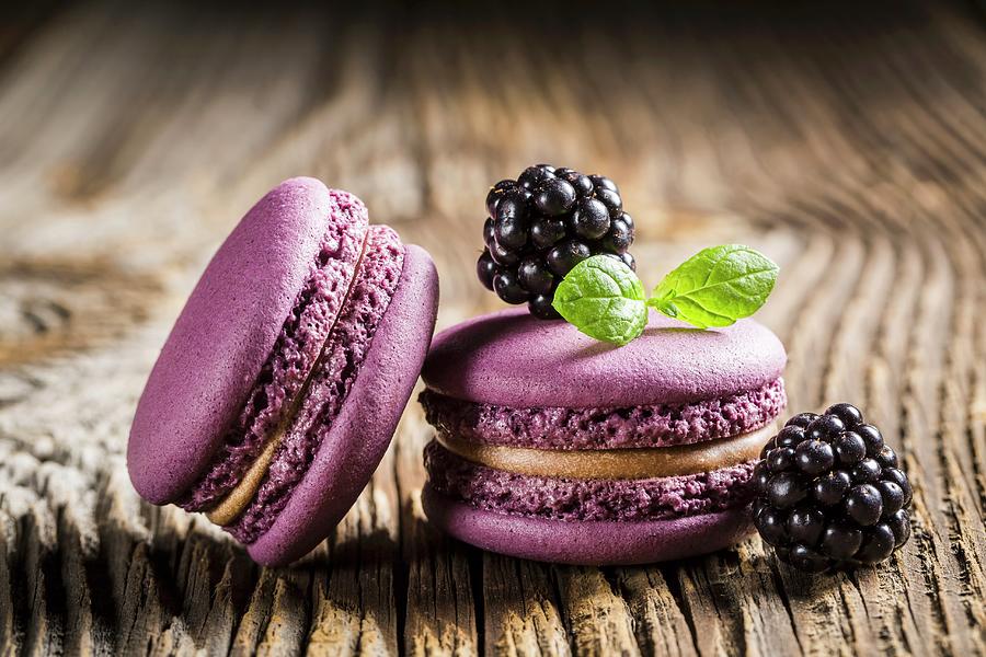 Blackberry Macaroons On A Wooden Table Photograph by Shaiith