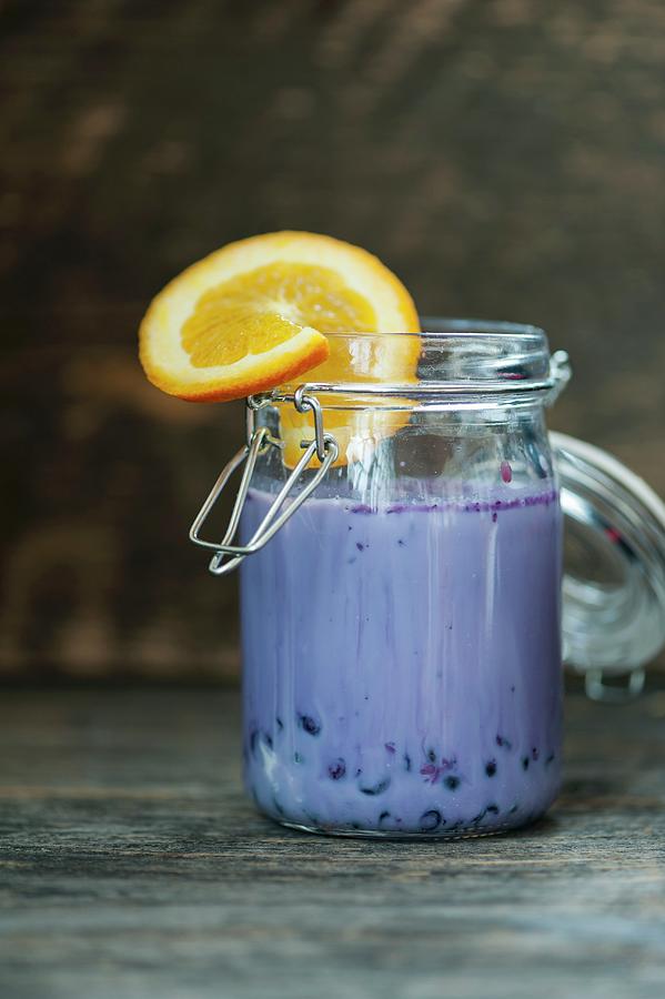 Blackberry Smoothie Decorated With A Slice Of Orange Photograph by Gabriela Lupu