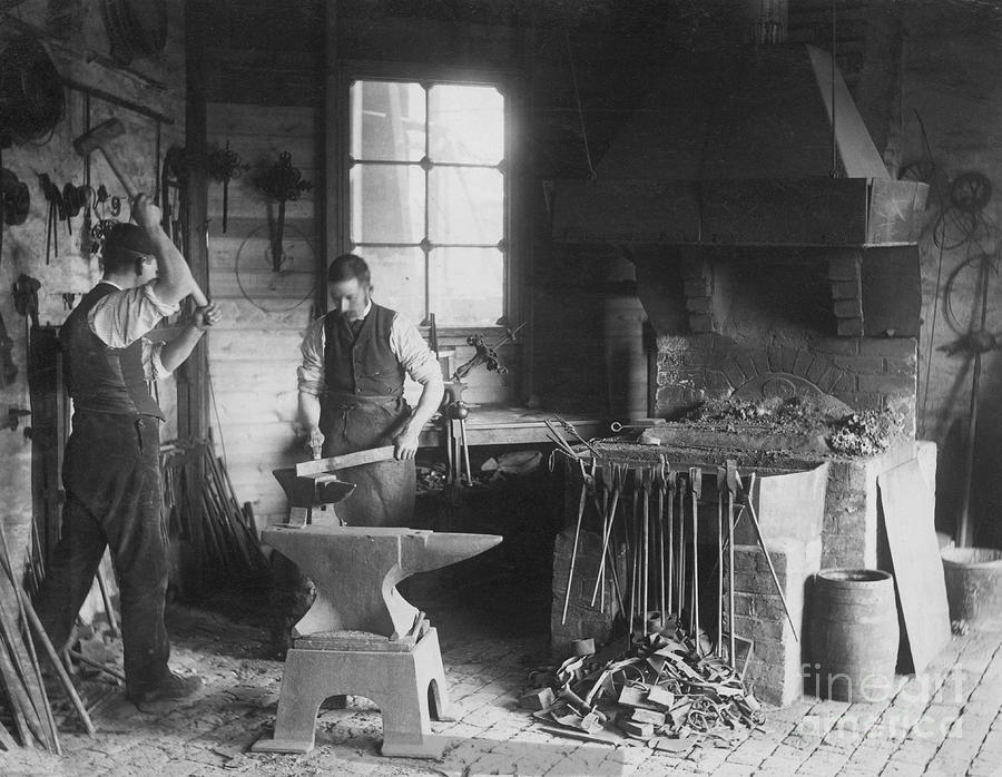 Blacksmiths Using Iron Forge Photograph by Bettmann