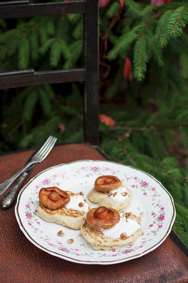 Blinis russian Pancakes Made From Buckwheat Flour Served With Sour Cream, Walnuts And Fried Wild Mushrooms Photograph by Kachel Katarzyna