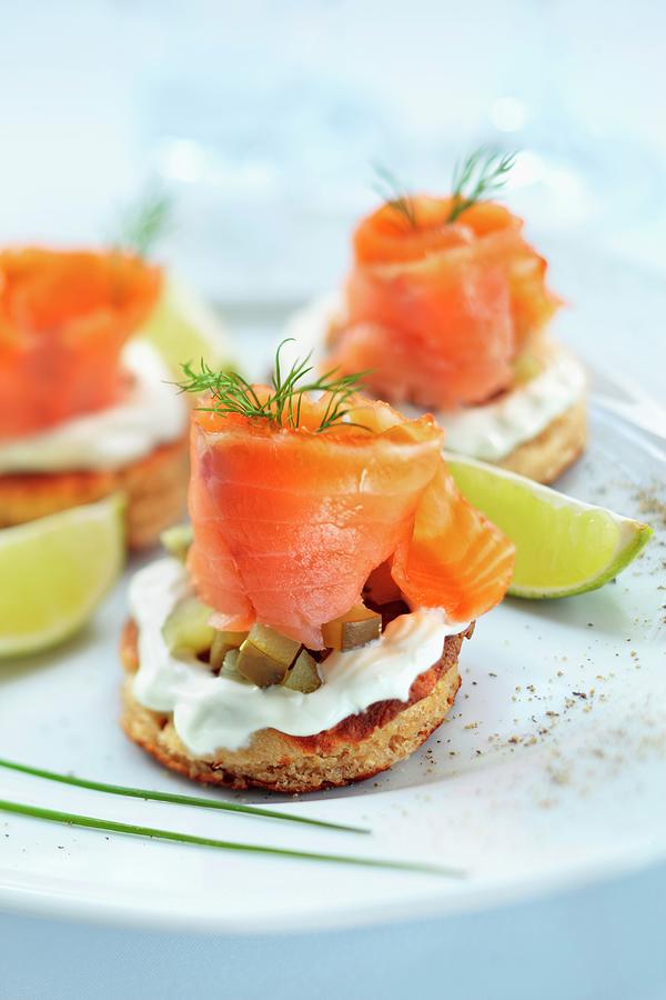 Blinis Topped With Smoked Salmon, Cream And Gherkins Photograph by Lukasz Zandecki