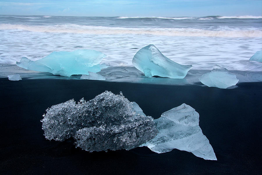 Blocks Of Ice On The Black Diamond Beach In Southeast Iceland, Breidamerkursandur, Iceland, Europe Photograph by Sonia Aumiller