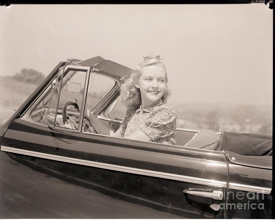 Blonde Woman Driving A Convertible Photograph by Bettmann