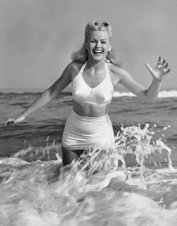 Blonde Woman In Two Piece Bathing Suit Photograph by George Marks