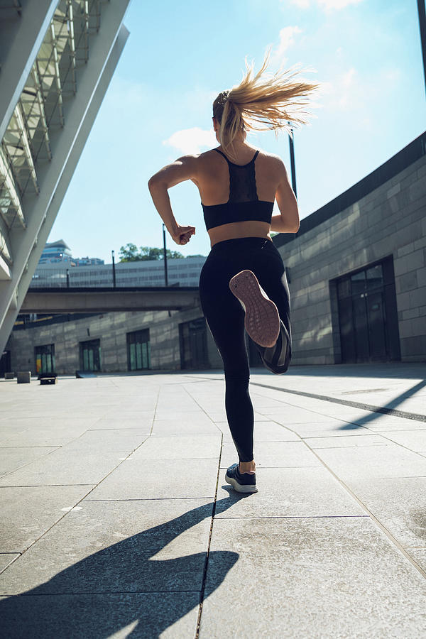 Blondie Woman In Black Sportswear , Trained Legs During Jogging Photograph by Cavan Images
