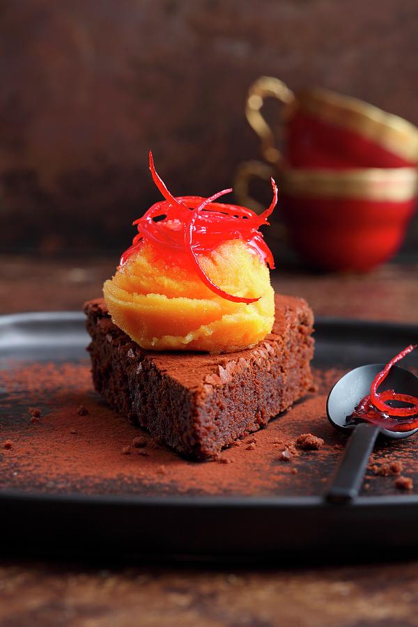 Blood Orange And Saffron Sorbet On A Slice Of Chocolate Tart Photograph by Jalag / Mathias Neubauer