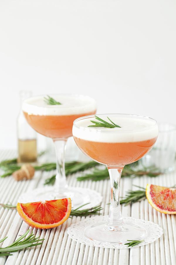 Blood Orange & Rosemary Martinis With Beaten Egg White Photograph by Jane Saunders