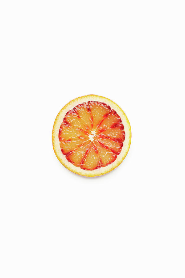 Blood Orange Slice On A White Background Photograph by Atelier Mai 98