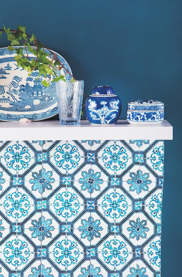 Blue And White Oriental China On Shelf Mounted On Blue Wall Photograph by Great Stock!