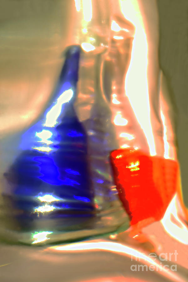Blue Bottle And Red Glass. Photograph