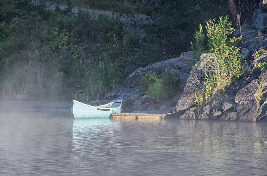 Blue canoe  Photograph by Debra Baldwin