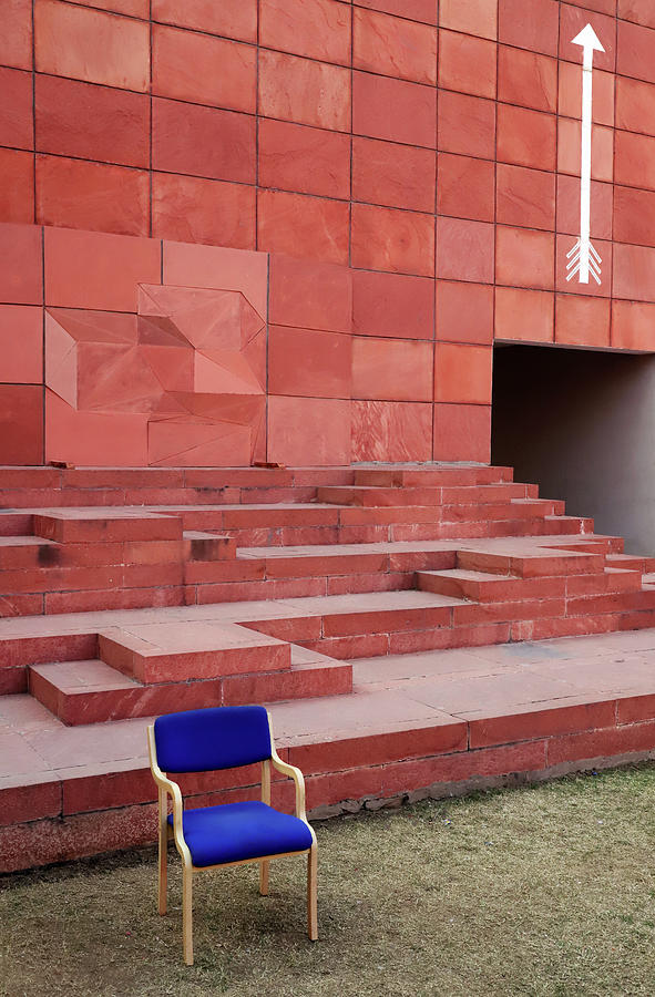 Blue Chair Versus White Arrow Photograph by Prakash Ghai