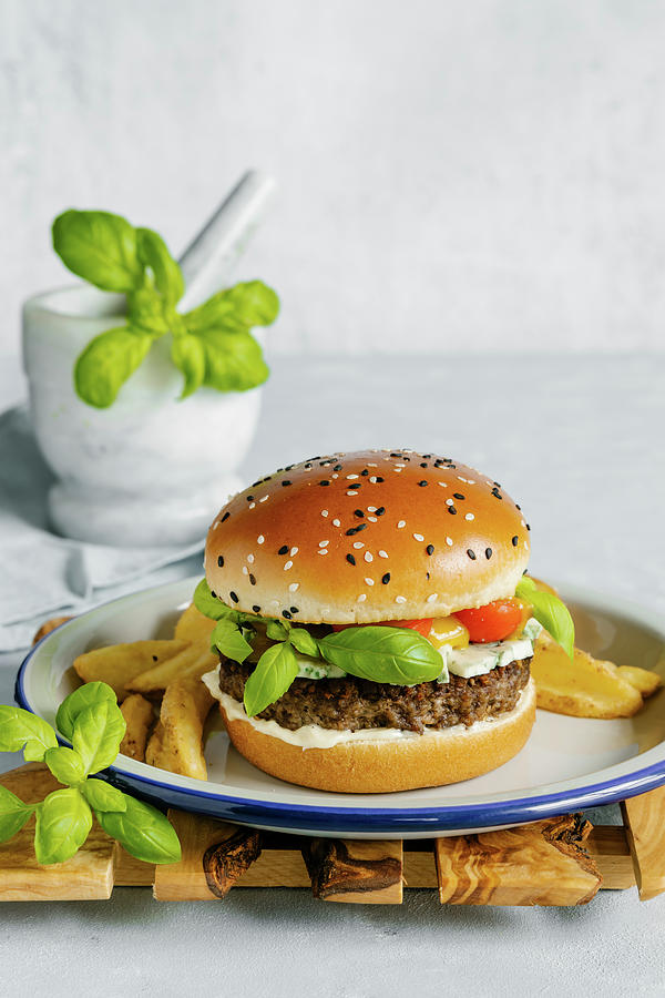 Blue Cheese And Basil Beef Burger With Mustard Barbecue Sauce Photograph by Alla Machutt