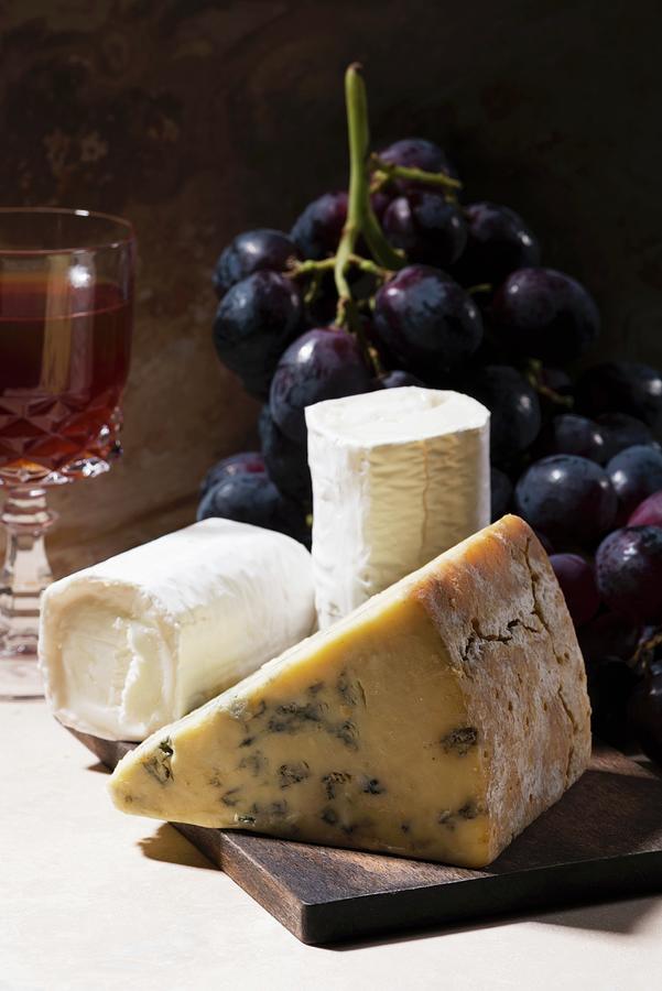 Blue Cheese And Goats Cheese With Grapes And Red Wine Photograph by Komar