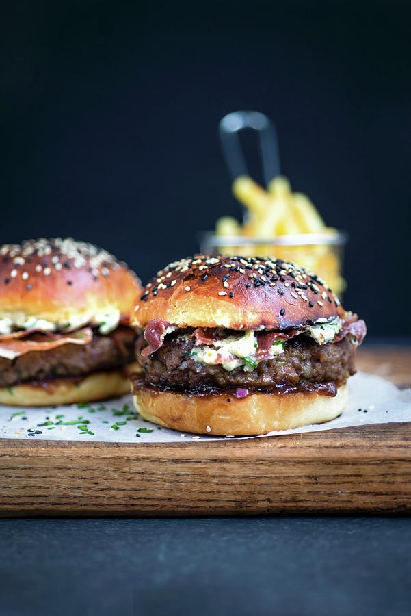 Blue Cheese Burgers On Brioche Buns With Pancetta Photograph by Lucy Parissi