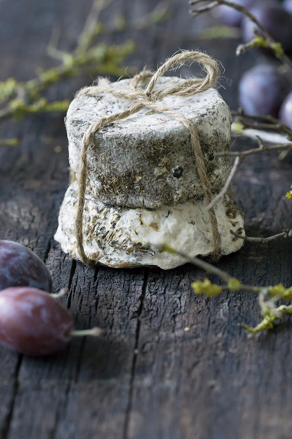 Blue Cheese With String And Plums Photograph by Martina Schindler