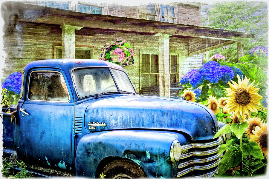 Blue Chevy in the Garden Photograph by Debra and Dave Vanderlaan
