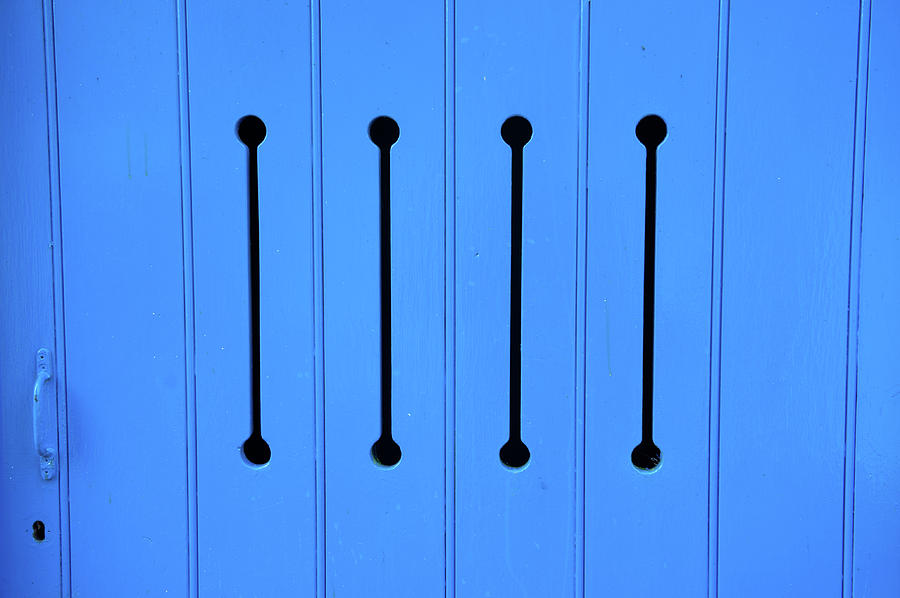 Blue Door with Arrow Slits Photograph by Helen Jackson