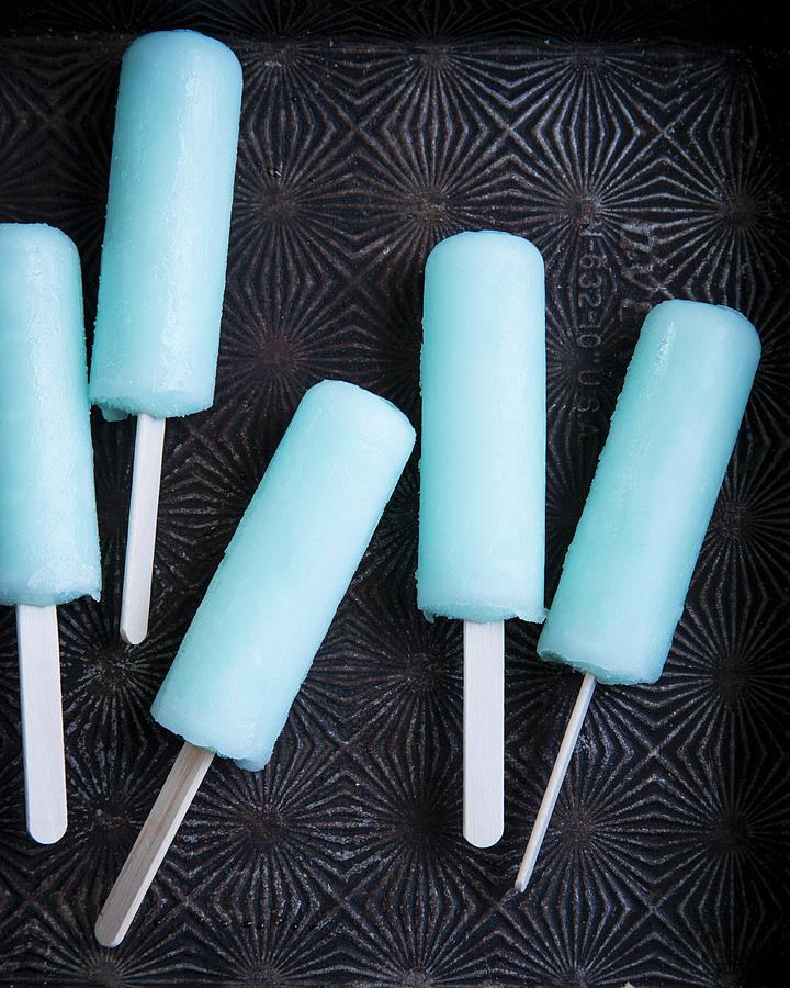 Blue Ice Lollies On A Metal Surface Photograph by Keller & Keller Photography