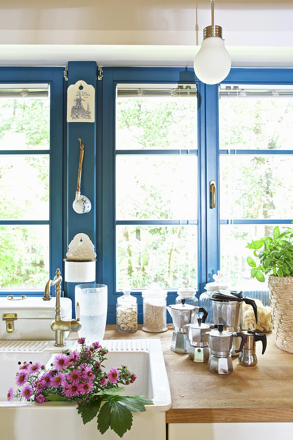 Blue Windows, Sink And Espresso Pots In Country-house Kitchen Photograph by Michal Mrowiec