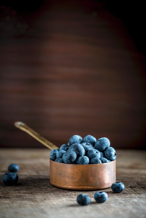 Blueberries In A Copper Pan Photograph by Nitin Kapoor