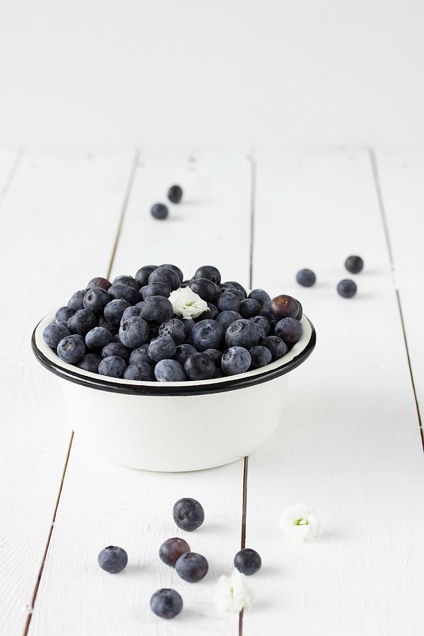 Blueberries In An Enamel Bowl Photograph by Emma Friedrichs