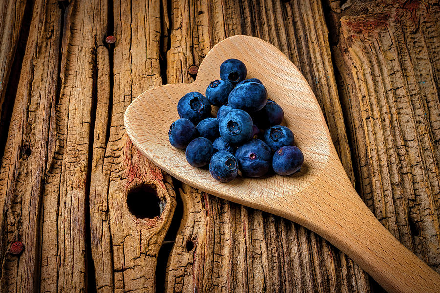 Blueberries In Heart Shaped Spoon Photograph by Garry Gay