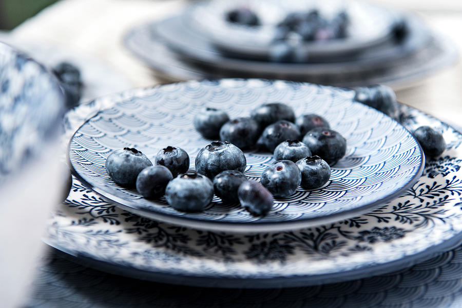 Blueberries On Blue And White Dishes close Up Photograph by Jelena Filipinski
