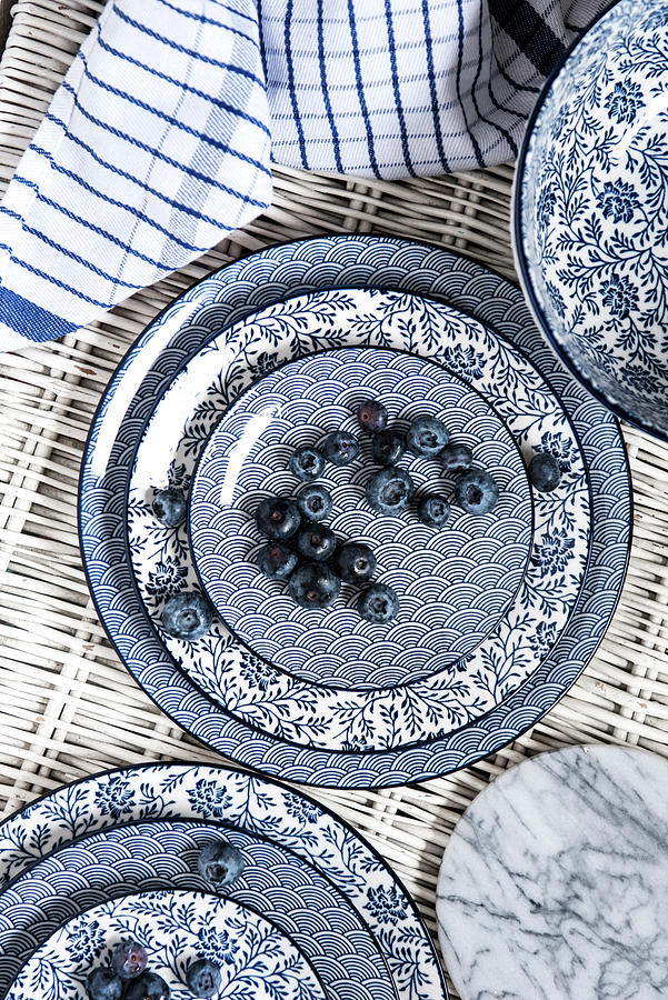 Blueberries On Blue And White Dishes Photograph by Jelena Filipinski