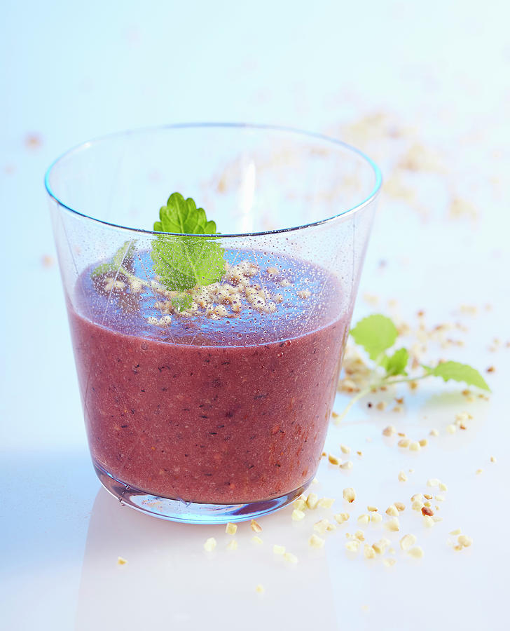 Blueberry And Hazelnut Smoothie With Apple And Orange In A Glass With Lemon Balm Photograph by Teubner Foodfoto