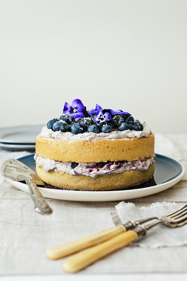 Blueberry Cake With Mascarpone And Blueberry Cream And Pansies Photograph by Magdalena Hendey