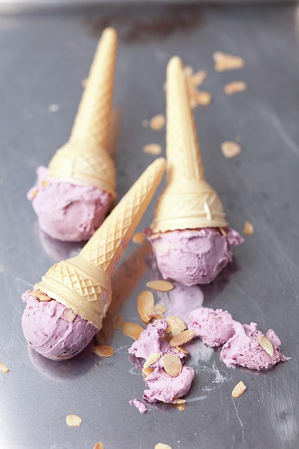 Blueberry Ice Cream With Flaked Almonds In Cones Photograph by Rua Castilho