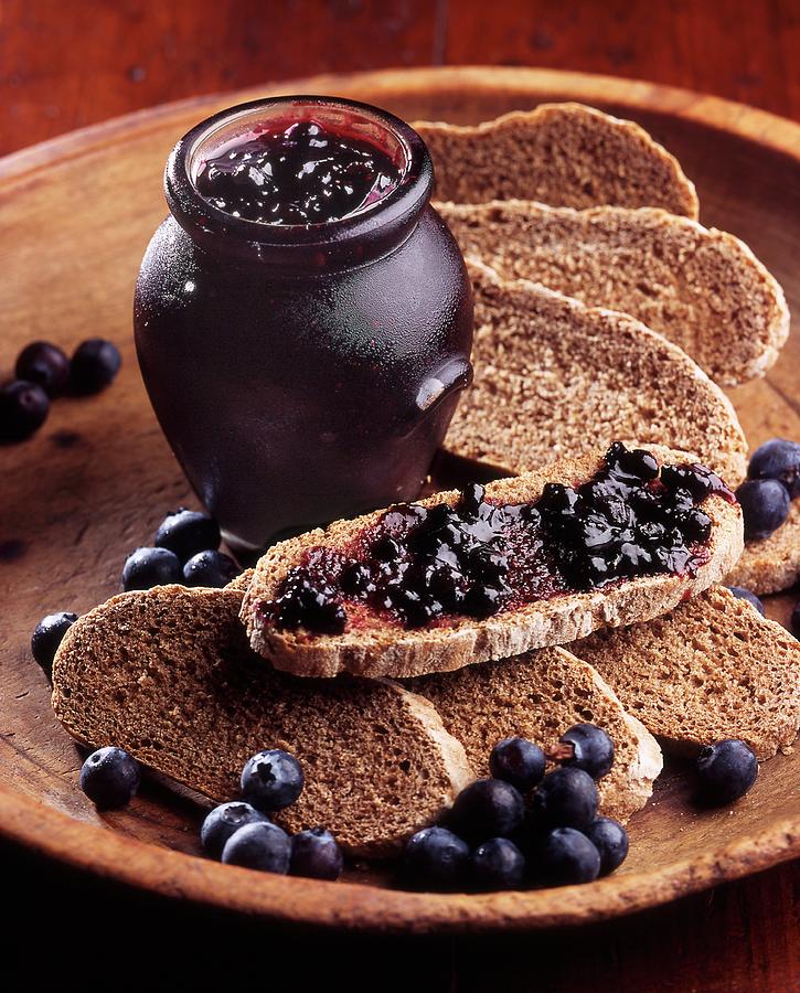 Blueberry Jam On Black Bread Photograph by Franco Pizzochero
