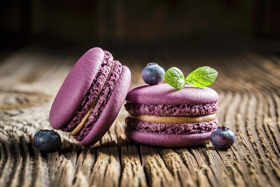 Blueberry Macaroons On A Wooden Table Photograph by Shaiith