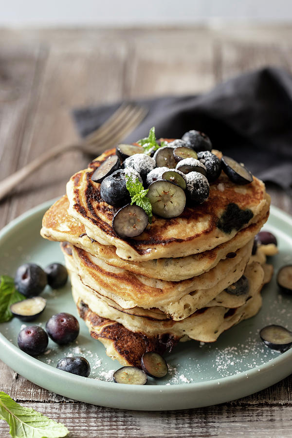 Blueberry Pancakes With Bluberries, Icing Sugar And Mint Photograph by Zuzanna Ploch