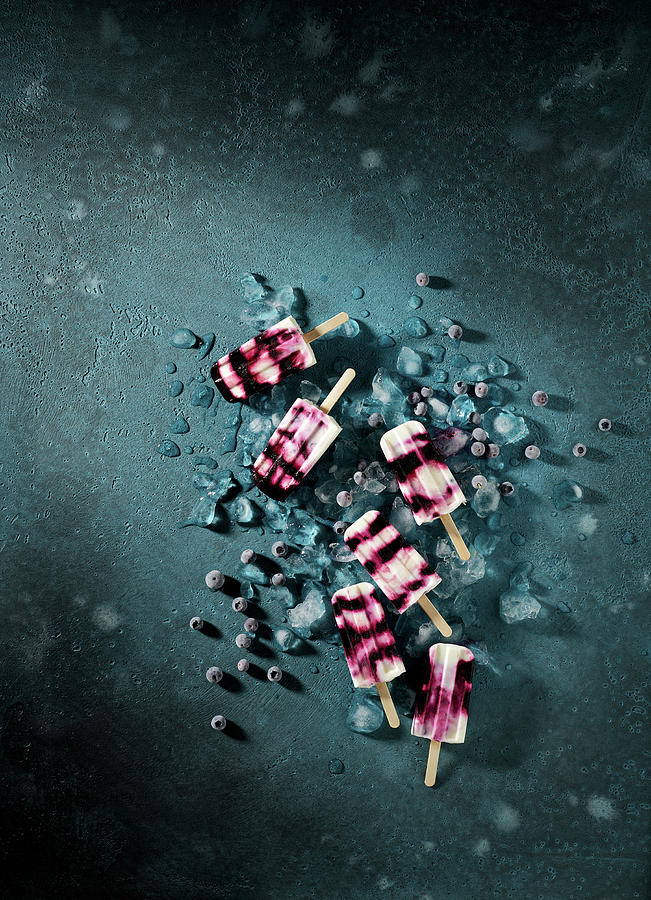 Blueberry Yogurt Popsicles On A Dark Surface Photograph by Michael Lffler