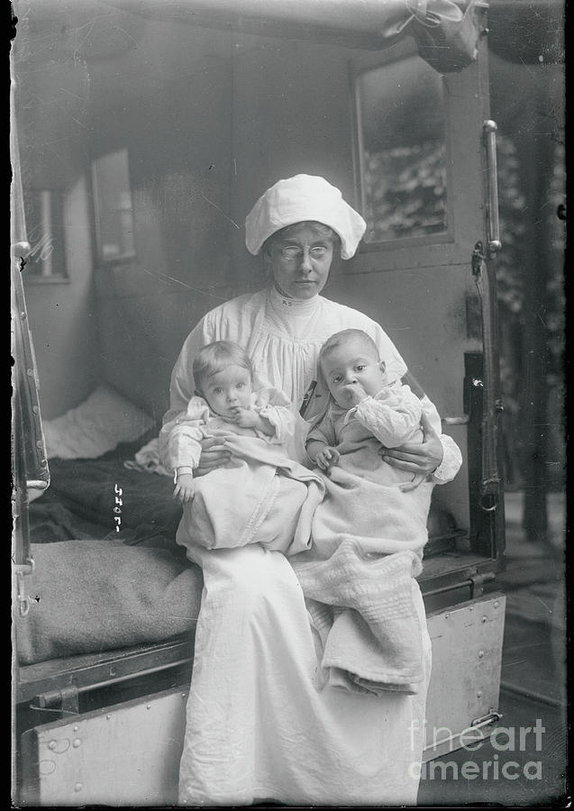 Board Of Health Nurse Holding Babies Photograph by Bettmann