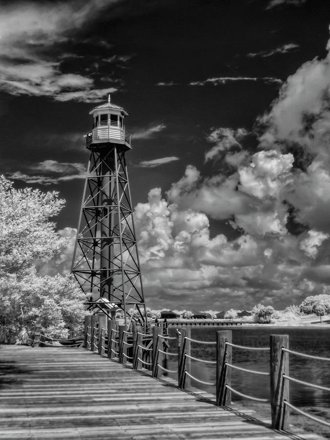 Boardwalk and Lighthouse in Lake Sumter Landing Photograph by Betty Eich