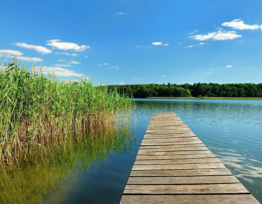 Boardwalk Dock On Lake Under Cloudy Photograph by Avtg