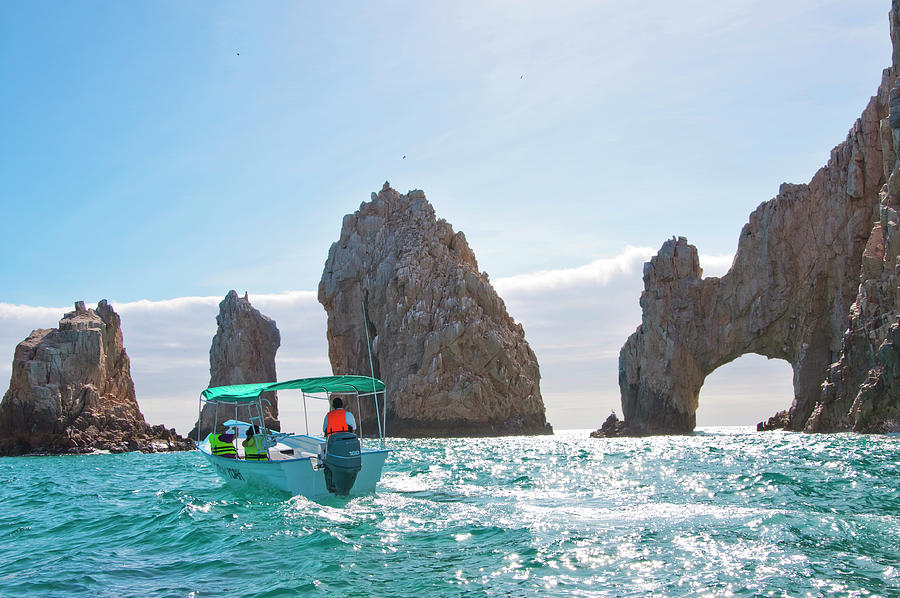 Boat By The Famous Rock Arch In Cabo San Lucas Photograph by Cavan ...