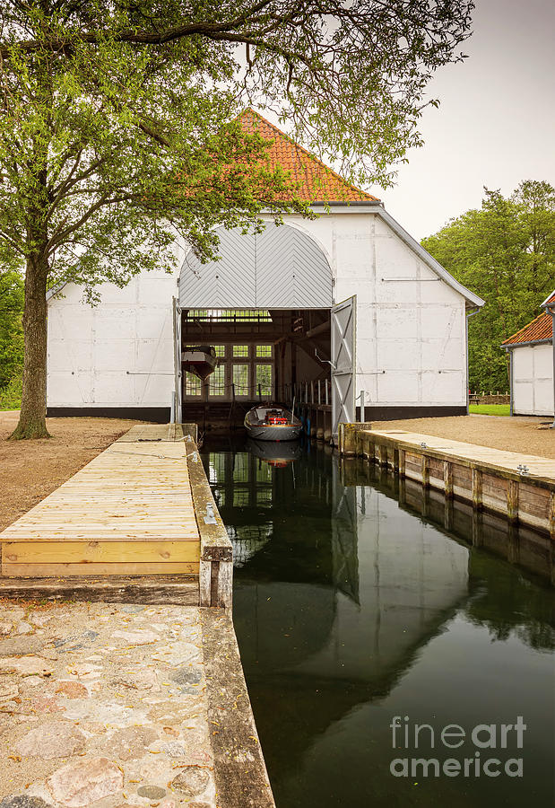 Boat house by lake Photograph by Sophie McAulay